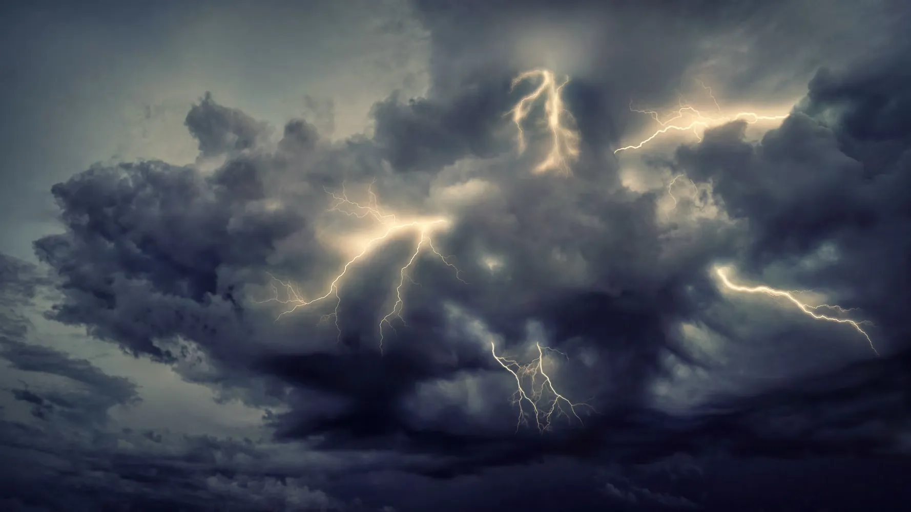 A severe storm illuminated by lightning